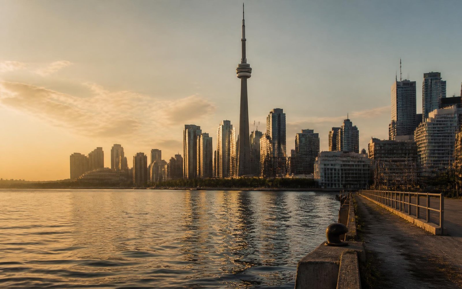Toronto skyline at golden hour across the waterfront, representing Canadian permanent residency pathways